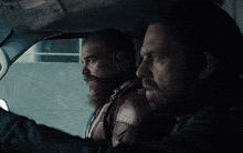 two men are sitting in a car and one of them is asking the other " what kind of user serv did you get "