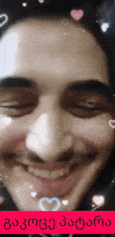 a close up of a man 's face with hearts around his eyes and the words " i love you "