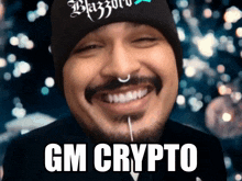 a man with a beard is smiling with the words gm crypto written on the bottom