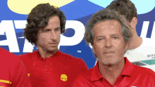 a man in a red shirt with a yellow skull on the front
