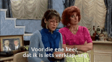 two women sitting next to each other with their arms crossed and the words voor die ene keer dat ik is iets verklap seg