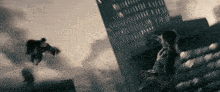 a man in a superman suit is flying over a building