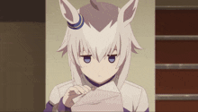 a girl with white hair and blue eyes is reading a letter