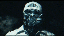 a man wearing a white hat with a skull on it