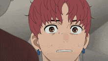 a close up of a person 's face with red hair