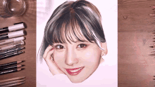 a drawing of a woman 's face is surrounded by pencils