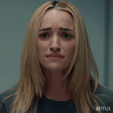 a close up of a woman 's face with a netflix logo on the bottom