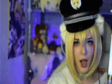 a woman is wearing a police hat and a cat ear headband