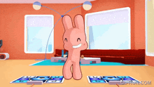 a pink bunny is dancing in a living room with a gif from giffun.com below it