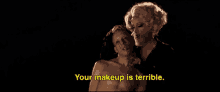 a man with blood on his face and a woman saying your makeup is terrible