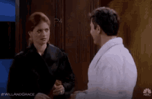 a man and a woman are standing next to each other and talking .