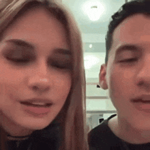 a man and a woman are looking at each other and talking .