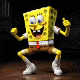 a cartoon character named spongebob squarepants is dancing and smiling