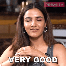 a woman with her eyes closed and the word very good on her face