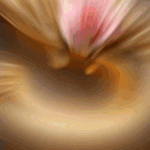 a blurred image of a person 's face with a pink light coming out of it