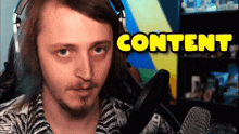 a man wearing headphones holds a microphone in front of a sign that says " content "