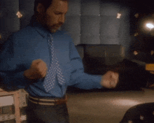 a blurry picture of a man in a blue shirt and tie