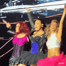 three women are on stage with their arms in the air and the caption rbd3d