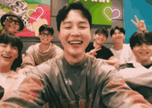 a group of young men are posing for a picture and one of them is smiling