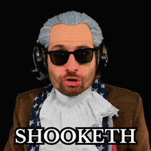 a man in a wig and sunglasses has the word shooketh on his face