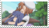 a blurry picture of a woman holding another woman in her arms in a forest .