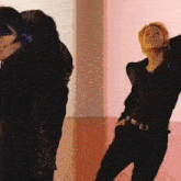 a man and a woman are dancing in a room .