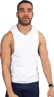 a man with a beard is wearing a white tank top and blue shorts