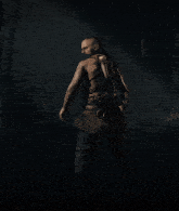 a man with a beard is holding a sword