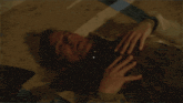 a man is laying on the floor with the words you ended that sentence with