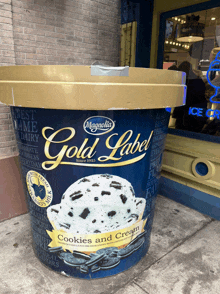 a giant bucket of gold label cookies and cream ice cream