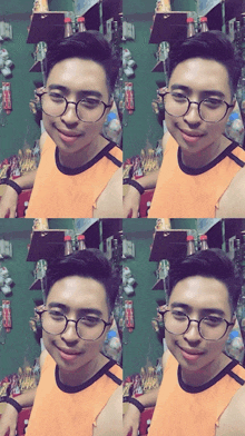a man wearing glasses and an orange tank top smiles for the camera