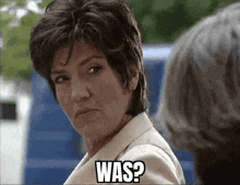 a woman in a suit says was while looking at another woman .