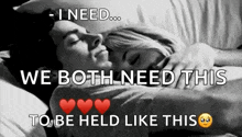 a man and a woman are hugging each other in a bed .