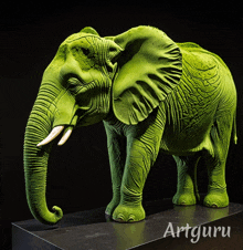 a green elephant statue with the word artguru on the bottom right