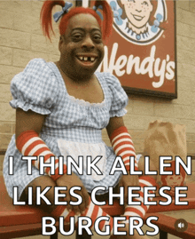 a wendy 's sign is behind a woman in a wendy 's costume