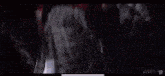 a woman in a red sweater is screaming at a man .