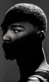 a black and white photo of a man 's face with the word victory in the corner
