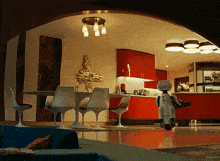 a robot is riding a scooter in a kitchen with the word kepler on the bottom right