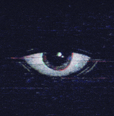 a close up of a person 's eye on a dark background