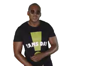 a man wearing sunglasses and a black shirt that says ams day on it