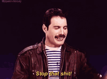 a man with a mustache and a striped shirt says stop that shit