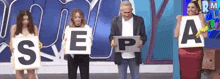 a group of people are holding up letters that spell out the word sepa