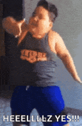 a fat boy wearing a tank top and blue shorts is dancing and says heeelllz yes !!