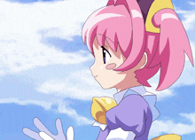 a cartoon girl with pink hair and a yellow bow on her head