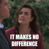 a woman in a red shirt stands next to a man in a suit and says " it makes no difference "