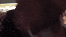 a blurry picture of a person 's face with the letter f visible
