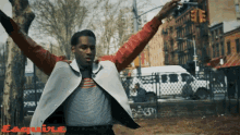 a man with his arms outstretched is featured in an esquire ad