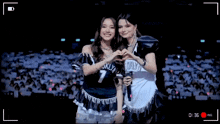 two women are posing for a picture with one wearing a brooklyn jersey