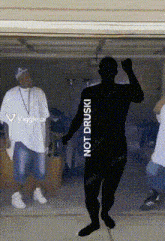 a silhouette of a man dancing in a garage with the words " not druski " on the bottom