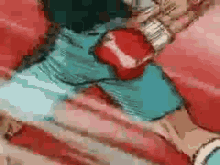 a pixelated image of a person wearing red boxing gloves